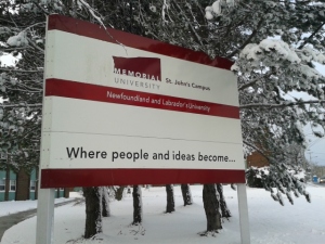 A sign reads "Memorial University, St. John's Campus: Where People and Ideas Become." Newfoundland and Labrador is one province that does not adhere to many of the trends that effect post-secondary education in the majority of Canada. For more information go to https://inequalitygaps.org/case-studies/our-most-recent-crop/government-funding-and-equitable-access-to-university-education-in-newfoundland-and-labrador-1949-2014/
